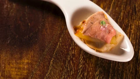 Roast beef, grilled pineapple, macauba and basil flower in a spoon. Taste gas Stock Footage 142593546