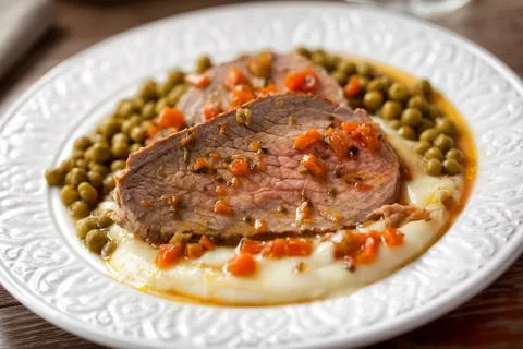 Roast Beef With Mashed Potatoes and Peas Stock Photos