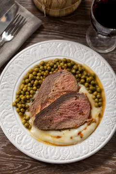 Roast Beef With Mashed Potatoes and Peas Stock Photos