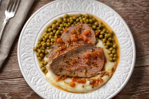 Roast Beef With Mashed Potatoes and Peas Stock Photos