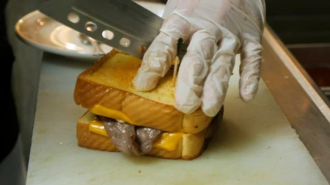 Roast beef sandwhich cut and ready to be put on plate 스톡 동영상 94271649