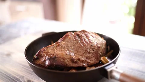 Roast beef with vegetables in a pan on a table Stock Footage 275214791