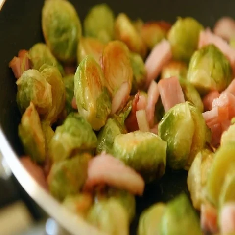 Roast brussels sprouts with bacon and ham Stock Footage 69667772