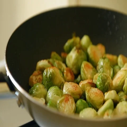 Roast brussels sprouts with ham Stock Footage 69662729