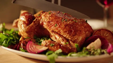 Roast Chicken on a table being carved Stock Footage 254595972