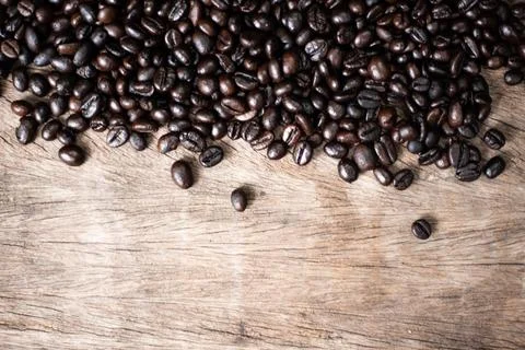 Roast coffee bean on wooden background Stock Photos