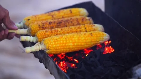 Roast corn. Chef cooking corn in a Jimbaran beach. Truck with roast corn. Stock Footage
