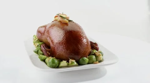 Roast duck with Brussels sprouts Video stock 8571438