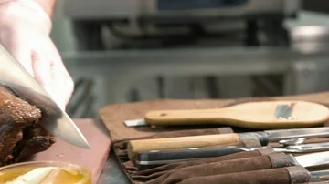 Roast duck is cut and plated by chef Stock Footage 86045941