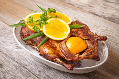 Roast duck with oranges Stock Photos