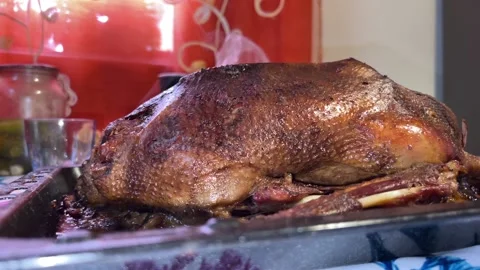 Roast goose on the kitchen table Stock Footage 224695155