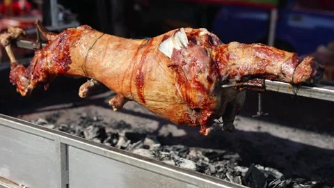 Roast lamb carcass on a spit. Grilled meat. 動画素材 263030378