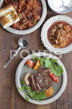Roast lamb with quinces, vegetables and ayran (South-East Turkey) Stock Photos