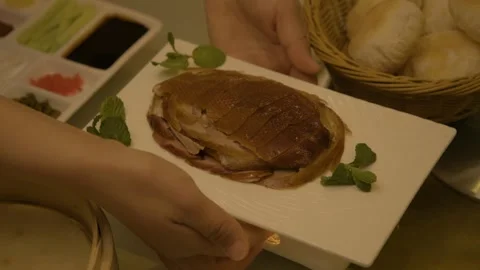 Roast Meat Platter with Condiments and Bread in Beijing Restaurant Setting Stock Footage 345788524