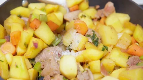 Roast Turkey cooked with vegetables in a pan. The cooking process adds salt to Video stock 150447945