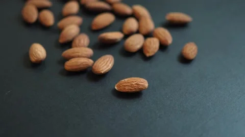 Roasted almonds panning through close up Stock Footage 104234489