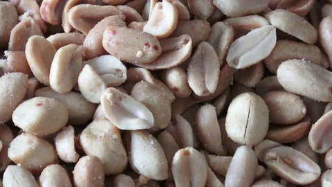Roasted and salted peanuts. Pile of peanuts. Stock Footage 83948891