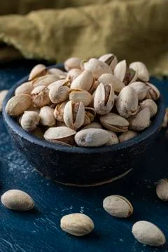 Roasted And Salted Pistachios In Ceramic Bowl Stock Photos