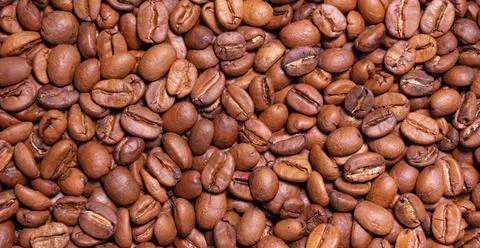Roasted arabica coffee bean full frame backdrop background texture Stock Photos