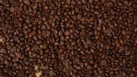 Roasted Arabica Coffee Beans On A Burlap Sack. Slow Motion Top View 4K. Stock Footage 195283208
