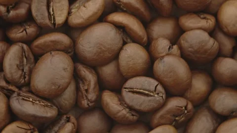 Roasted aromatic coffee beans are spinning Stock Footage 292901960