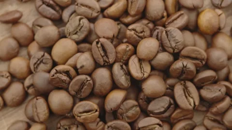 Roasted aromatic coffee beans are spinning Stock Footage 292902230