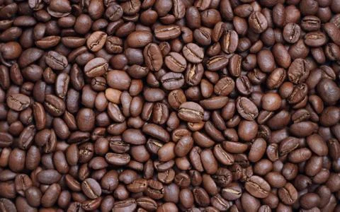Roasted aromatic coffee beans as background Stock Photos