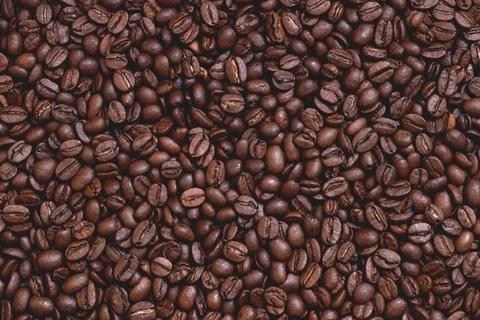 Roasted aromatic coffee beans as background Stock Photos