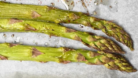 Roasted Asparagus on the table 스톡 동영상 249959748