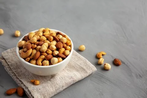 Roasted Assorted Nut Mix with Cashews, Almonds and Hazelnuts in a Bowl, sid.. Stock Photos