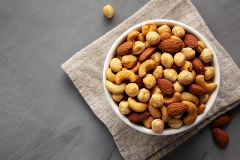 Roasted Assorted Nut Mix with Cashews, Almonds and Hazelnuts in a Bowl, top.. Stock Photos