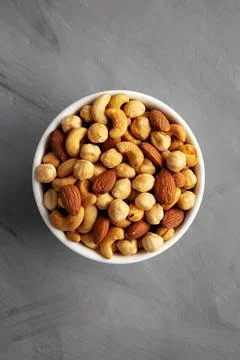 Roasted Assorted Nut Mix with Cashews, Almonds and Hazelnuts in a Bowl, top.. Stock Photos