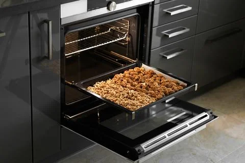 Roasted baked walnuts close up on a baking sheet Stock Photos
