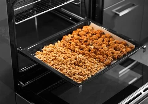 Roasted baked walnuts close up on a baking sheet Stock Photos