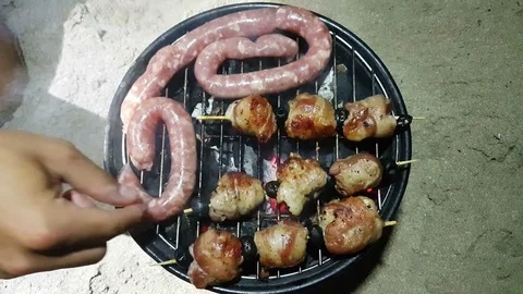 Roasted on the beach with camping barbecue Stock Footage 82718767