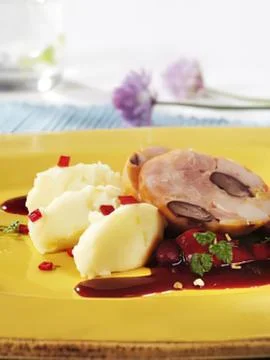 Roasted beef with mashed potatoes and berry sauce Stock Photos