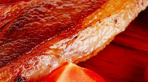 Roasted beef meat bone steak on red wood 스톡 동영상 45599177