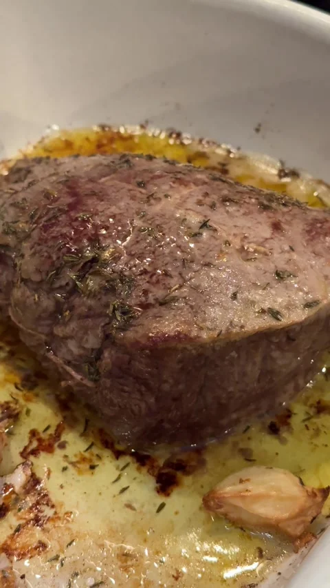 Roasted beef tenderloin with garlic Stock Footage 296412241