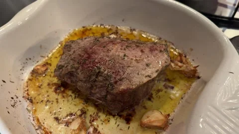 Roasted beef tenderloin with garlic Stock Footage 296412254