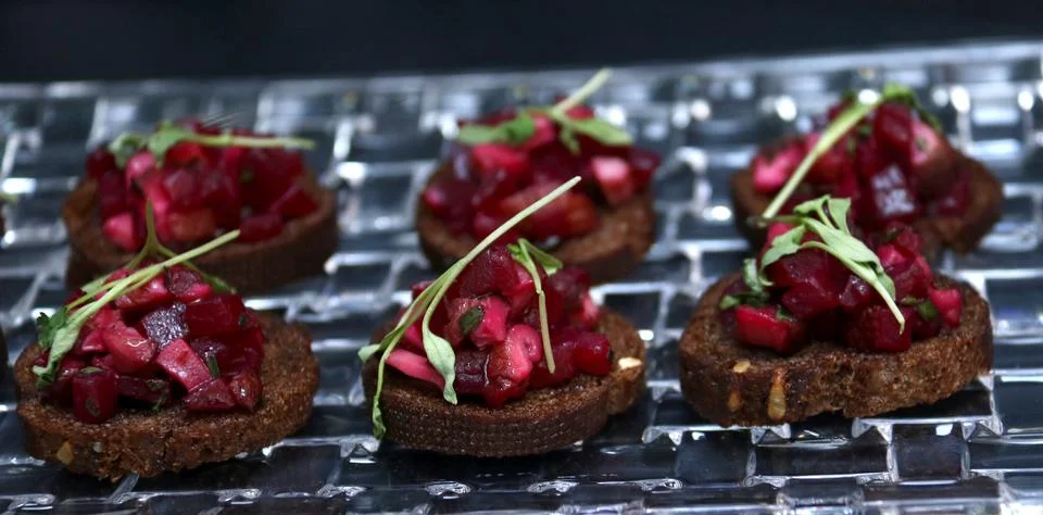 Roasted beet appetizer on dark bread Stock Photos