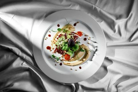 Roasted beetroot and pine nut salad in a plate. Vegetarian food Stock Photos