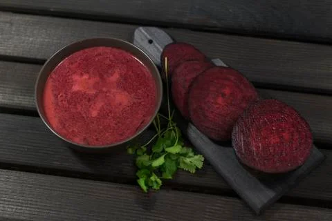 Roasted beetroot soup on a dark background. Baked beets soup. Christmas dish. Stock Photos