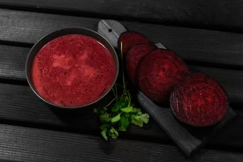 Roasted beetroot soup on a dark background. Baked beets soup. Christmas dish. Stock Photos
