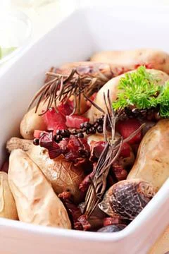 Roasted beets and potatoes in a baking dish Stock Photos