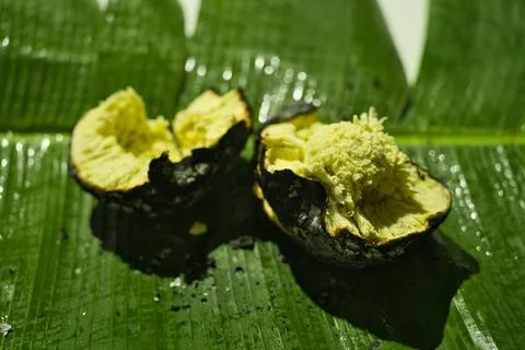Roasted Bread fruit  under, break open on banana leaves, Seychelles autanti Stock Photos