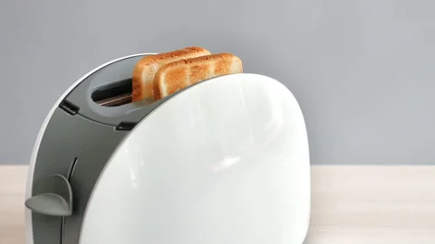 Roasted bread slice jumping from white gray toaster cooking breakfast sandwich 스톡 동영상 245476894