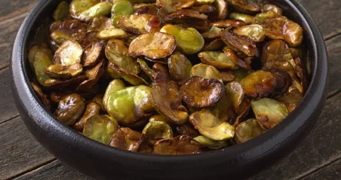 Roasted broad beans in a bowl. Stock Footage 313835254