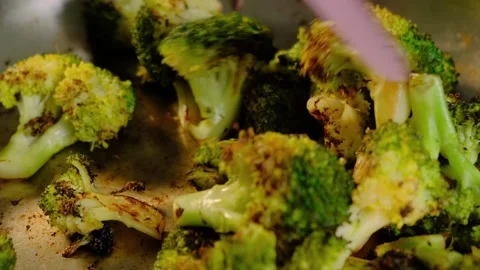 Roasted Broccoli Cooking in Pan with Spatula, Kitchen Close-up Video stock 341437133