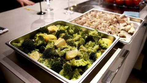 Roasted broccoli florets with lemon on baking tray Stock Footage 113016445
