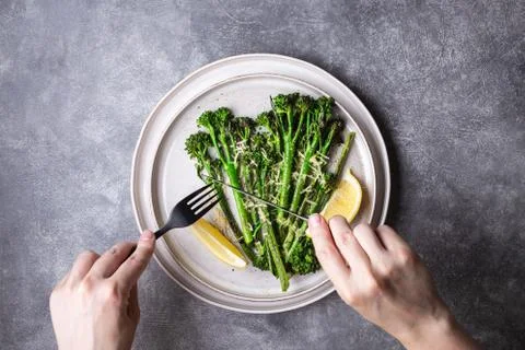Roasted broccolini on the plate. Stock Photos